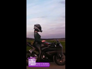 in leather leggings on a motorcycle
